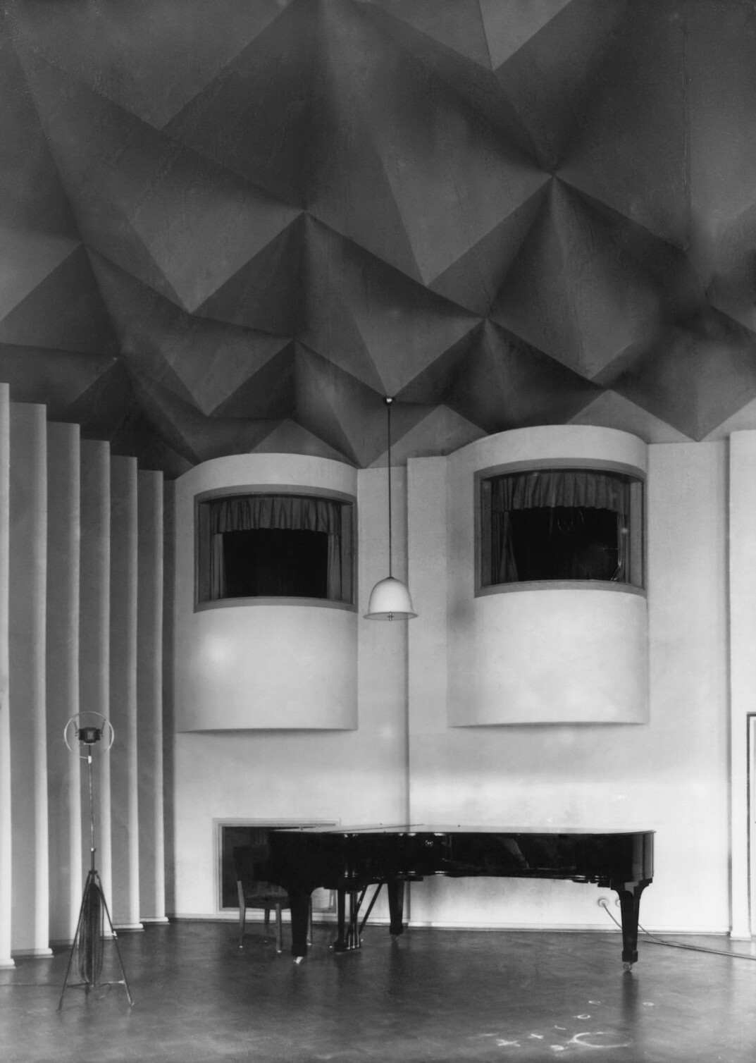 Broadcast microphones and acoustic panels in a studio