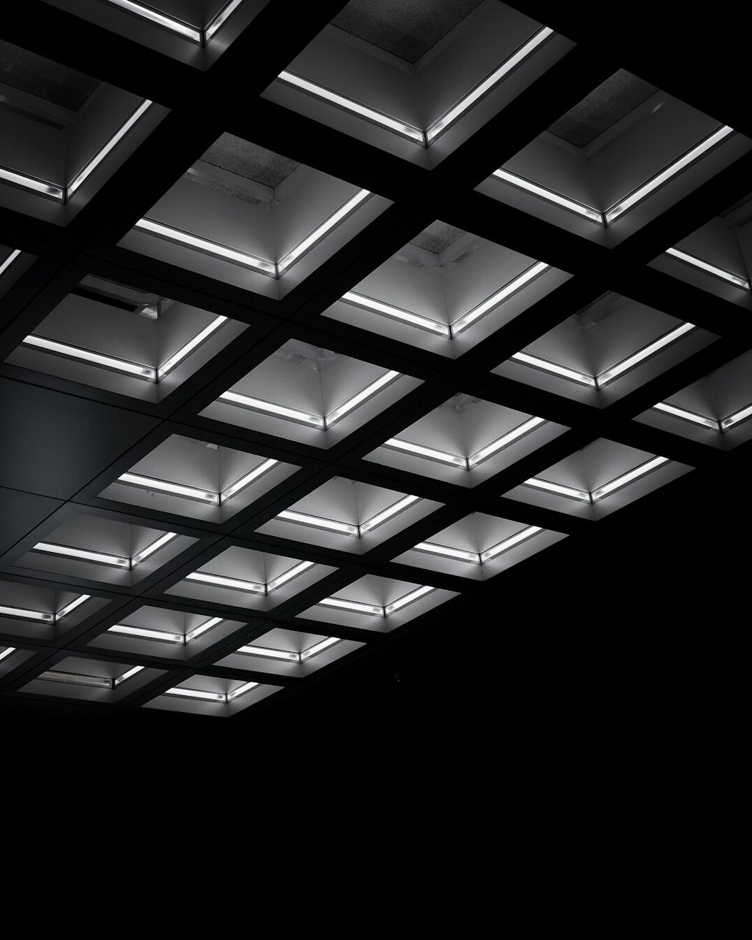 Overhead studio lighting grid with LED panels and softboxes